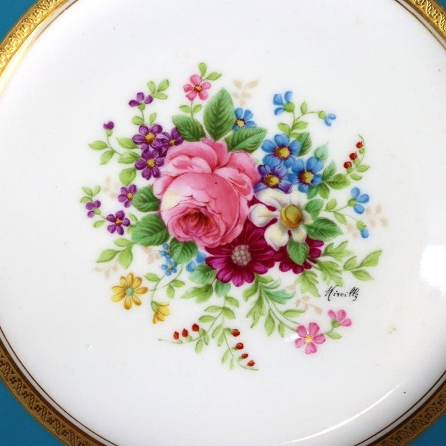 A set of twelve French Limoges porcelain luncheon plates by G. Ahrenfeldt, dating to approximately 1900. Each plate...