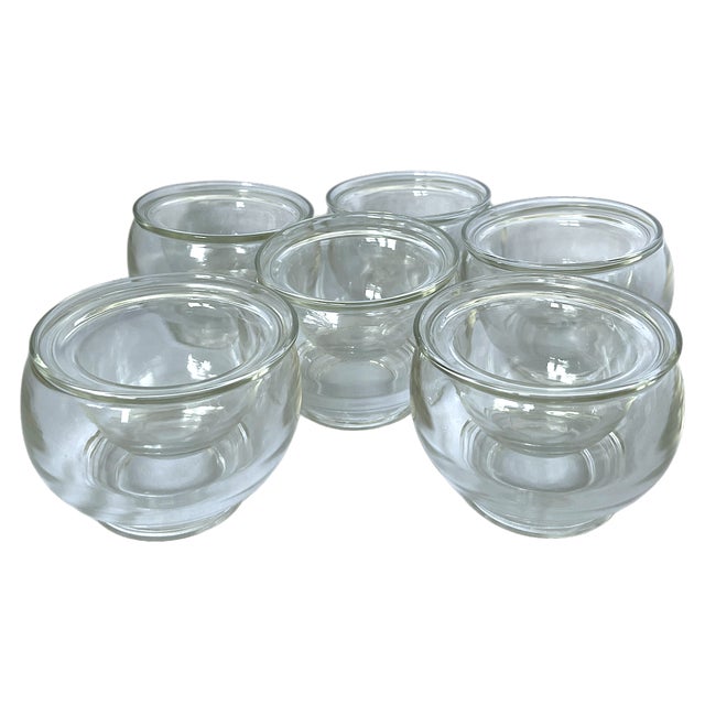 A sleek and versatile set of six double-walled glass bowls, thoughtfully suited for elevated entertaining. The sculptural...
