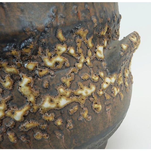 A very rare two-piece plant stand by Jopeko Keramik West-Germany. It consists of a large planter with two handles and a...