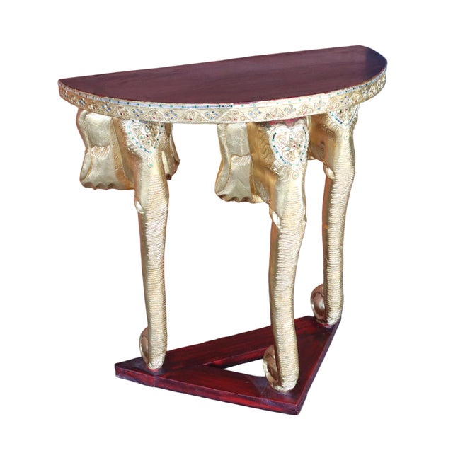 Vintage Thai demi lune hallway table. Constructed from hard wood with a deep red stain. The legs of the table are three...