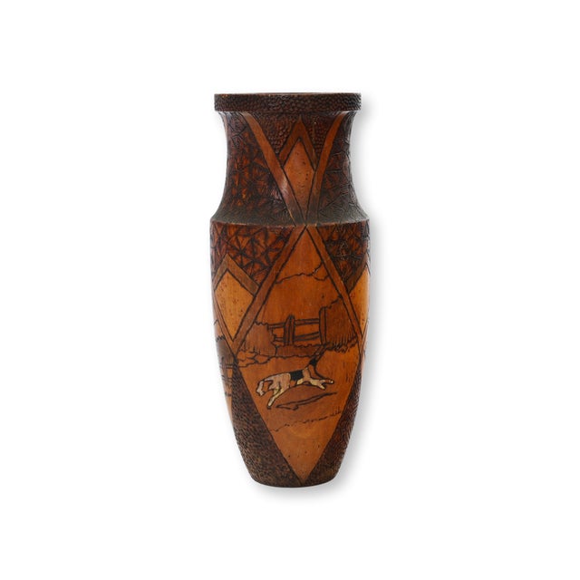 A beautifully crafted vintage hand-turned wooden vase featuring a meticulously hand-painted hunting scene that wraps...