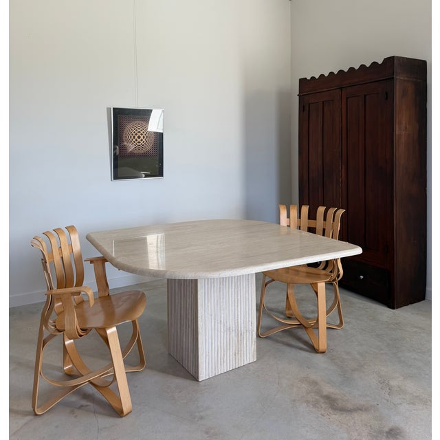 Rhombus Form Travertine Dining Table attributed to circa 1980s Italian production by Stone International. 69.5" measured...
