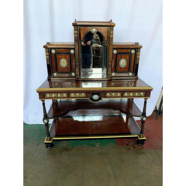 A fine 19th century french kingwood and porcelain mirrored cabinet on stand. The upper portion fitted with a central...