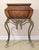 Enhance your space with this Maitland Smith vintage gilt steel rope vanity table, a beautifully designed piece that...