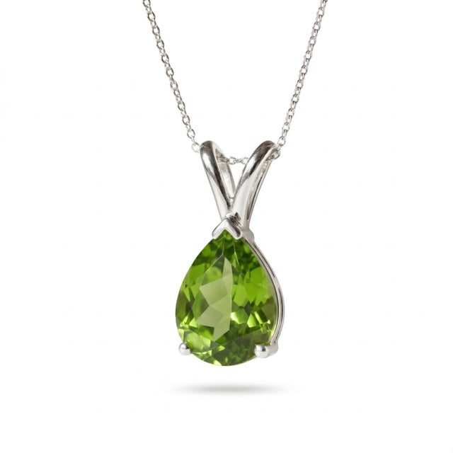 This elegant pendant necklace showcases a vibrant Peridot gemstone, admired for its fresh green hue and radiant...