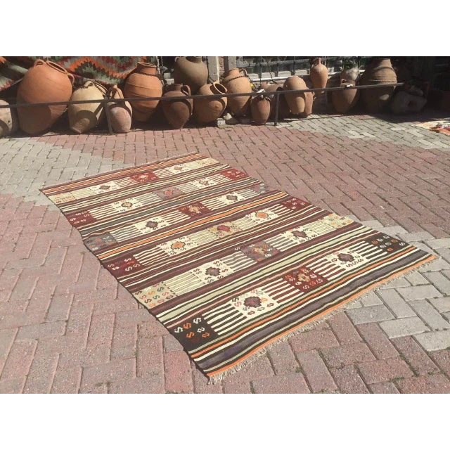 This beautiful, vintage, handwoven kilim is approximately 60 years old. It is handmade, of very fine quality hand spun...