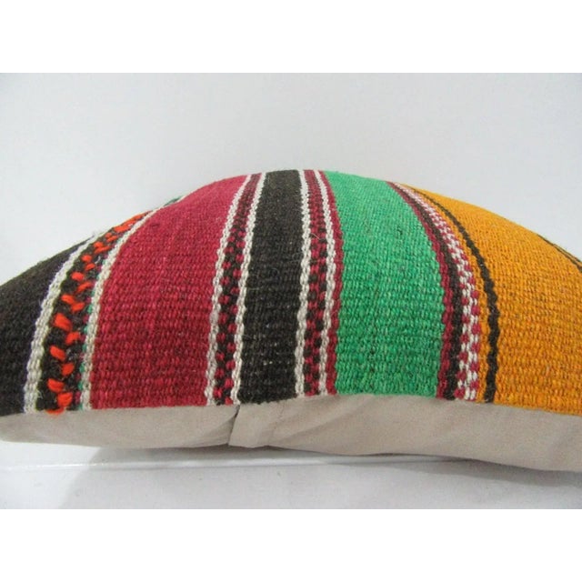 This is a pillow cover made from a vintage kilim rug. The piece was properly washed and ready to use. Pillow inserts not...