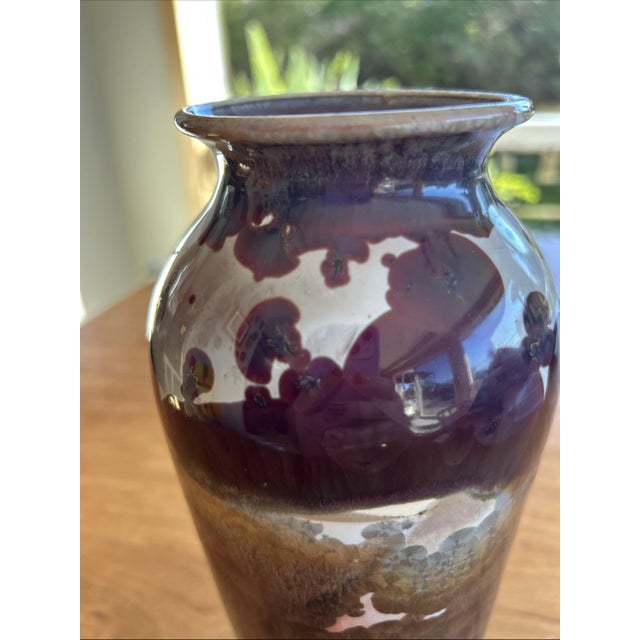 This 1948 vintage signed vase is a beautiful piece of ceramic art, standing at 9.5" tall and showcasing a unique glossy...