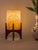 Comet pairs a hand-carved Egyptian alabaster shade with a geometric walnut base, combining contemporary form with...