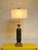 A dramatic vintage table lamp featuring a hand-carved solid wood column adorned with flowing acanthus leaves and classical...
