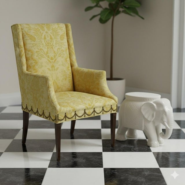 This is a Chinese chippendale style wingback chair with scalloped nailhead trim. The fabric feels like a cotton or cotton...