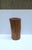 A natural wood pedestal side drinks table, in the Organic Modern style, circa late‑20th century. A rich brown natural wood...