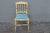 1940's carved wood, patinated occasional chair. Powder blue fabric in good condition. Upholstery tacks in place. 19"seat...