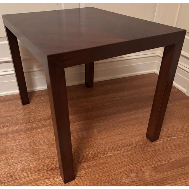 Stylish mid-century walnut side table with beautiful book-matched top.