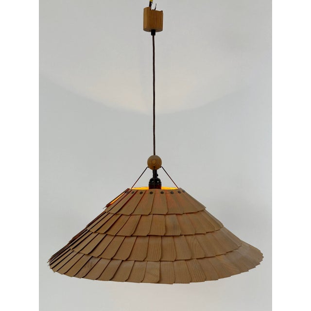 Extremely rare, stunning and highly decorative mid-century modern pendant lamp or hanging light. Manufactured by vest...