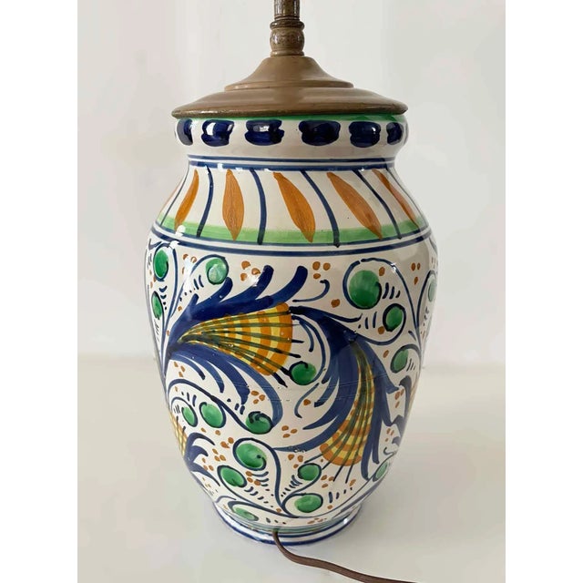 Vintage Italian hand painted, glazed ceramic lamp. Marked 'Italy' on the bottom. Includes starter shade. Height to top of...