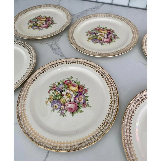 Offered is a lovely vintage set of dinner plates by The Edwin M Knowles China Co. This set features a floral design with...