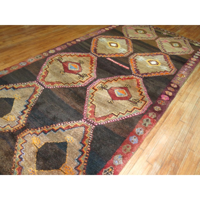 One of a kind 20th century handwoven Turkish rug from our one of a kind attitude collection. Large Bold Medallions hover...
