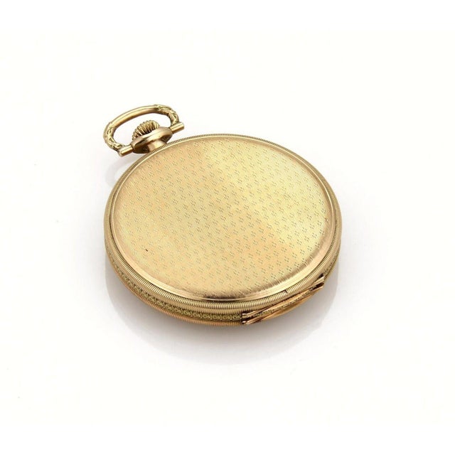The Omega 14k Gold 15 Jewels Hand Wind Pocket Watch is a luxurious timepiece that exudes elegance and sophistication....