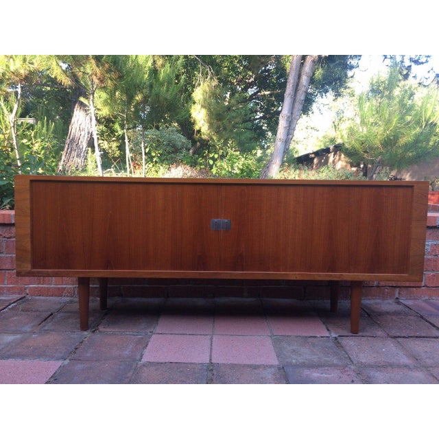 Original condition mid century Hans Wegner "President" Teak Sideboard. Made in Denmark by Ry Mobler. With tambour doors,...