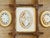 This charming three-piece wall grouping features handcrafted shell art displayed in complementary vintage frames, creating...