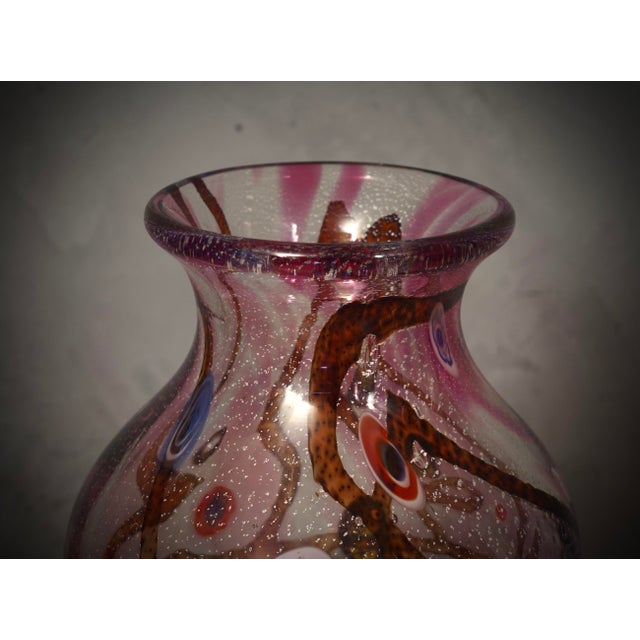 Fantastic vase from the Murano glassworks, both for its particular workmanship and for the color, in fact the vase is...