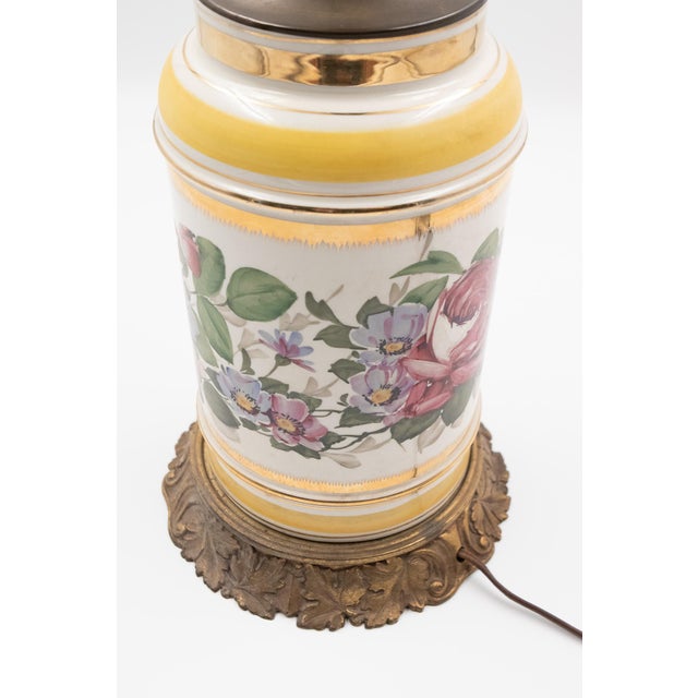 Cylindrical porcelain body with hand-painted botanical decoration in the English floral tradition — full-blown cabbage...