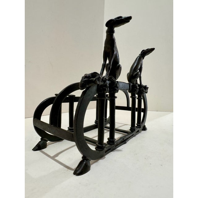 Antique black metal dog figural letter holder or desk organizer. Features two seated dog figures above an openwork divided...