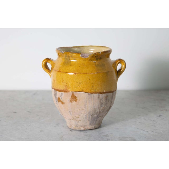This 19th-century Spanish pottery jar is a beautiful example of rustic Mediterranean craftsmanship. Handcrafted from...