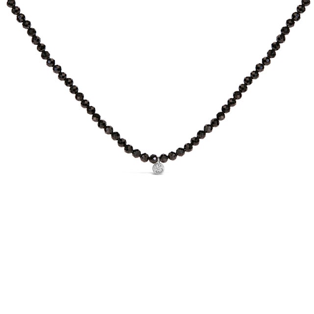 Discover elegance redefined with this exquisite necklace, a symphony of sophistication in .925 sterling silver, adorned...