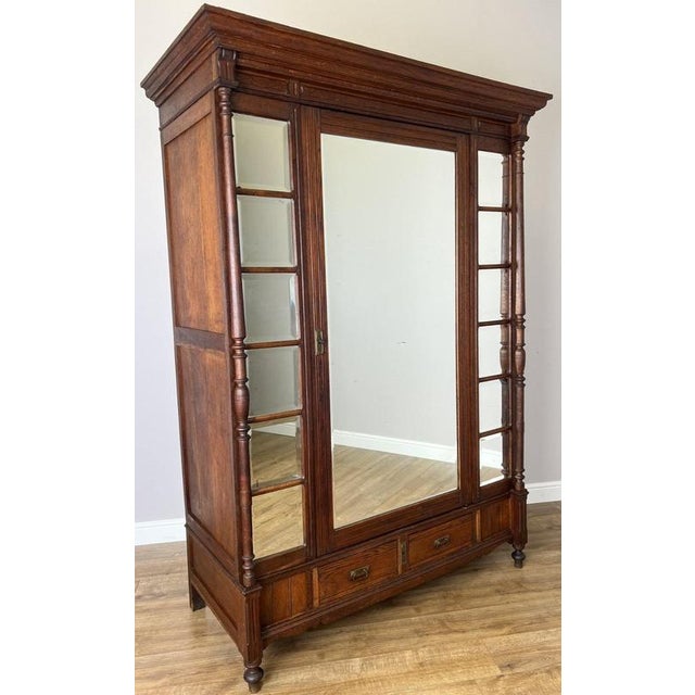 Introduce timeless French elegance into your home with this beautiful Antique French Oak Wardrobe, featuring a rich brown...