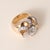 Retro Diamond Floral Cocktail Ring in Rose Gold & Platinum Circa 1940s A striking example of mid-century Retro design,...