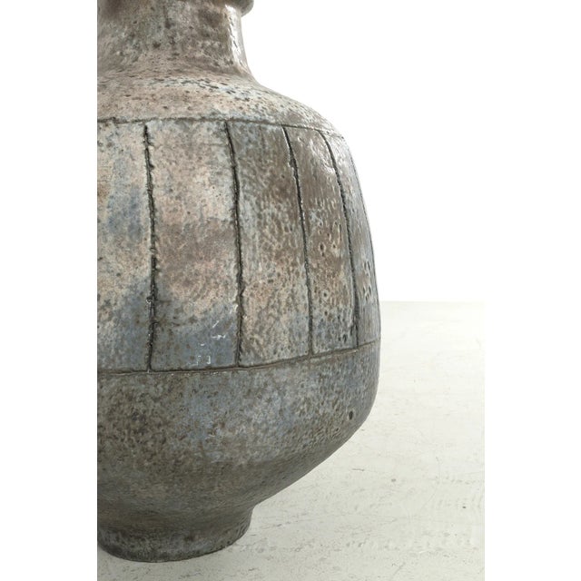 Amazing huge floor vase with an ear by Studio Keramiek from Germany. The vase has a wonderful gray color with subtle blue...