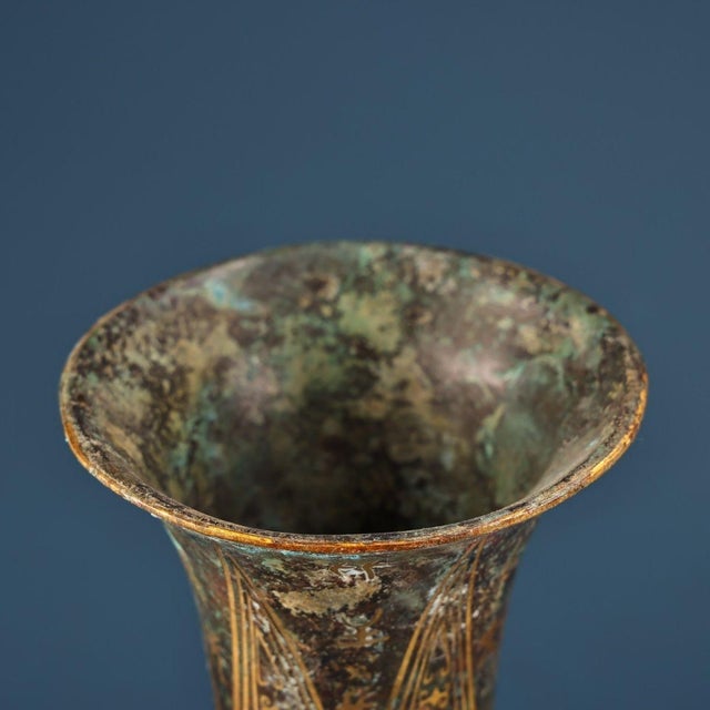 This striking vintage bronze vessel is a beautiful example of Chinese archaistic metalwork. Crafted from bronze with a...