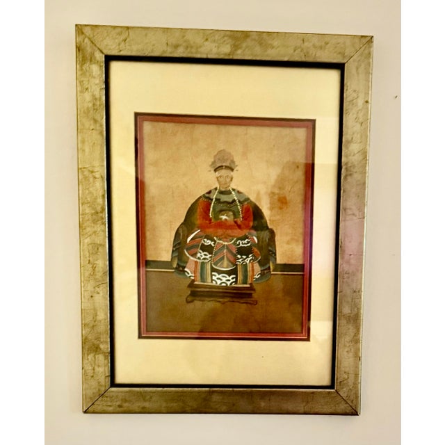This is a framed antique Chinese ancestral portrait painting, likely from the Qing Dynasty (19th century) depicting a...