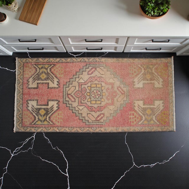 Vintage Turkish small rug from Oushak, 1970s, featuring warm sunwashed terracotta tones and authentic village...