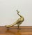 Gracefully sculpted from solid brass, this vintage peacock features an elongated, flowing silhouette with a stylized fan...