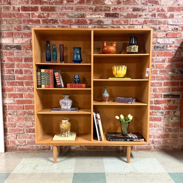 Vintage mid-century Danish modern No. 6 oak bookcase designed by Scandinavian furniture legend Gunni Omann for Omann Jun...