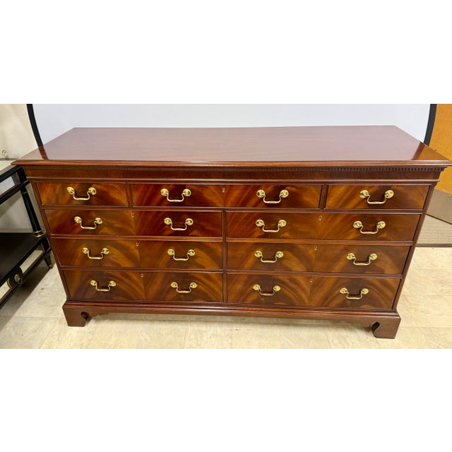 Elegant Hickory Chair dresser is crafted from rich mahogany veneers and solids, showcasing a deep, lustrous finish that...