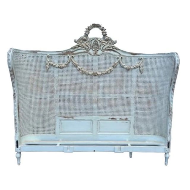 This Queen Size Bed Frame features a Louis XV Floral Swag double hole cane headboard, curved footboard, rails, and slats,...