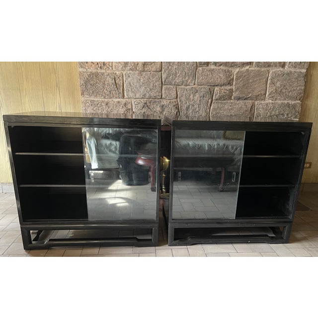 Pair of Mid-Century Glass Front Display Cabinets - Black Gloss finish 34" w x 20" d x 33" h Both glass doors slide in two...