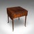 This is an antique reader’s table. An English, mahogany Pembroke or sofa table with book storage, dating to the Regency...