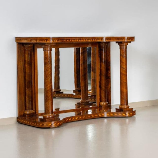This exquisite mid-19th century console table features mirrored back panel and robust full columns at the front,...