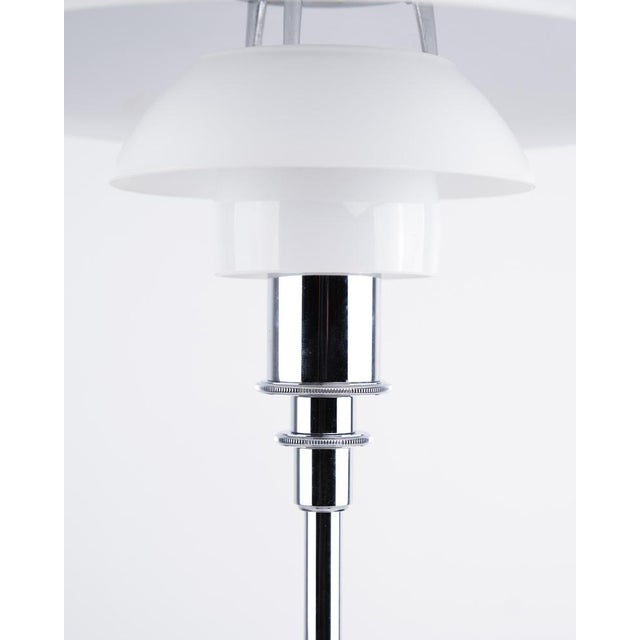 Ph 3/2 table lamp designed by poul henningsen and produced by louis poulsen. The lamp is made with shades in white opal...