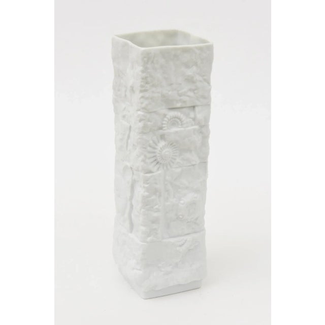 This vintage 1960's German Kaiser textural fossilized vase or vessel in white bisque is dimensional. The elements shown...