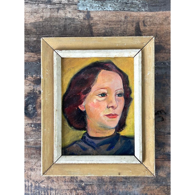 This evocative original oil portrait, dated 1940, captures a moment of quiet contemplation through a traditional mid-...