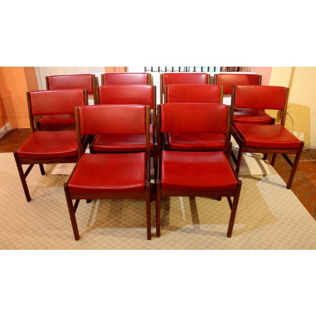 1970s set of 10 mid century modern side chairs, English. Teak with original red vinyl upholstered backs & seats. Stylishly...
