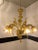 Classical amber Murano glass chandelier with flowers and leaves. Traditional piece of Italian art of blowing glass. Very...