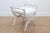 A Swedish Empire style painted wooden Curule stool from the mid-19th century, with spindle arms, X-form base and new...