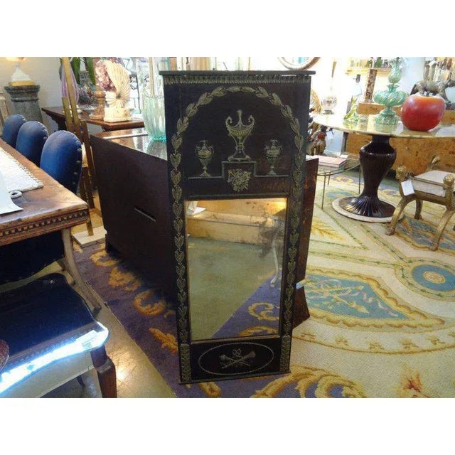Antique French Empire/Neoclassical style ebonized and painted vertical mirror from the 1920s. This versatile French...